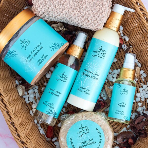 Group shot of the Beirut Nights product family in a basket featuring Body Sugar Scrub, Body Lotion, Body Mist, Dry Oil and Loofah Baladi Soap
