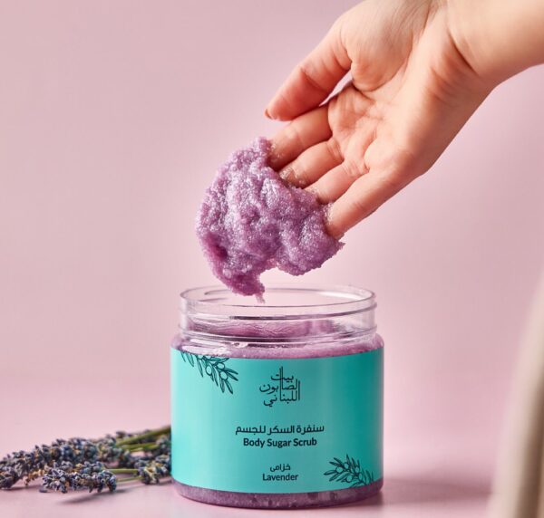 Naturally luxurious Lavender Body Sugar Scrub by House of Soap being scooped out by hand