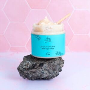 Naturally luxurious Lychee Body Sugar Scrub by House of Soap pictured on a rock