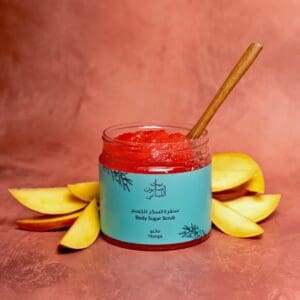 Naturally luxurious Mango Body Sugar Scrub by House of Soap with a wooden tool